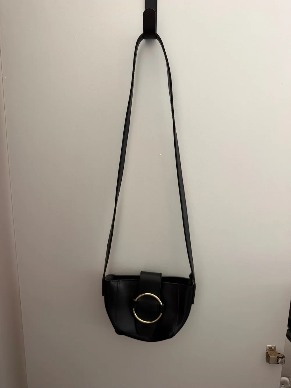 Chic Black Crossbody Bag with Gold Ring Accent